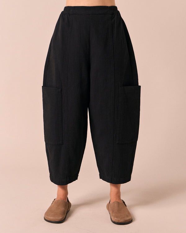 model wears amala black gauze trousers front