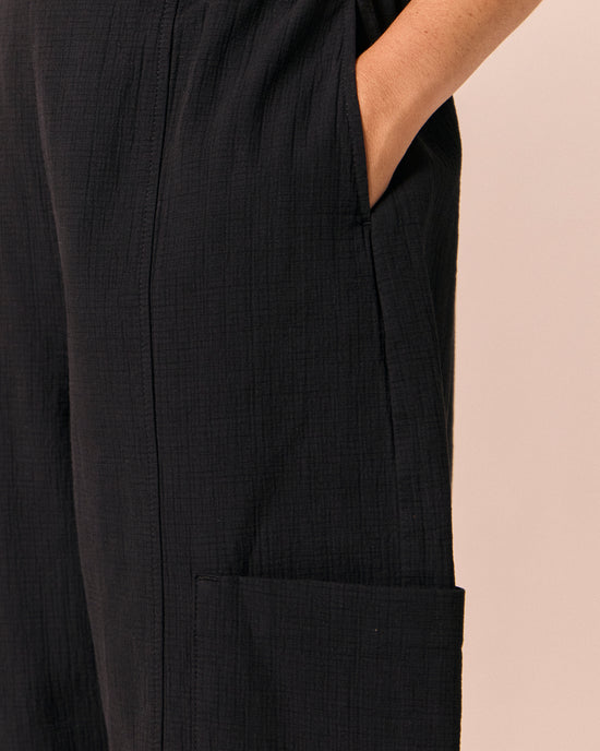 model wears amala black gauze trousers 