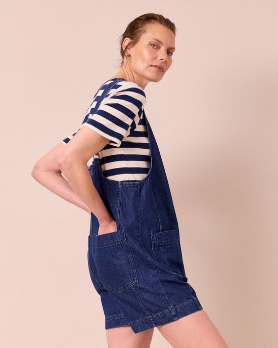 model wears the anica mid blue denim playsuit