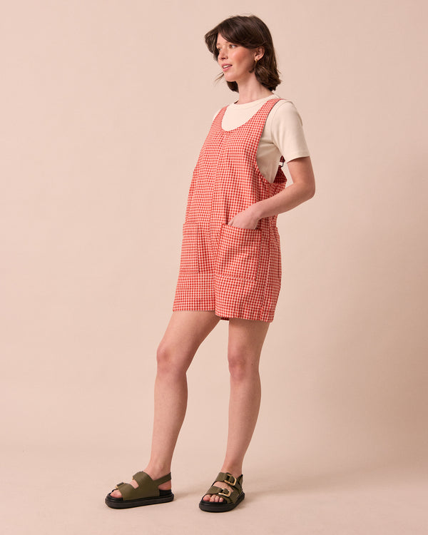 model wears anica poppy red gingham playsuit