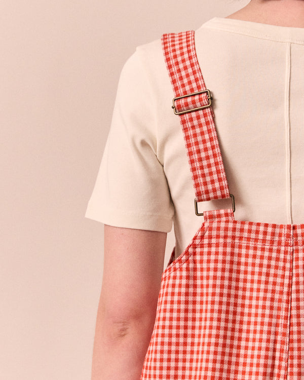 model wears anica poppy red gingham playsuit