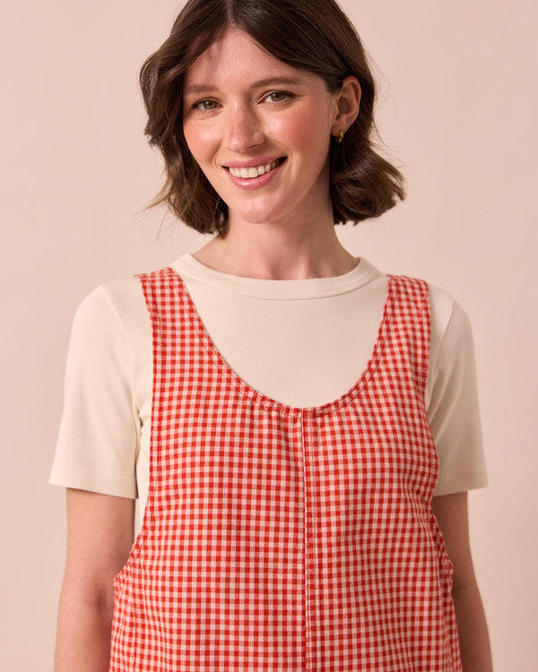 model wears anica poppy red gingham playsuit