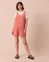 model wears anica poppy red gingham playsuit