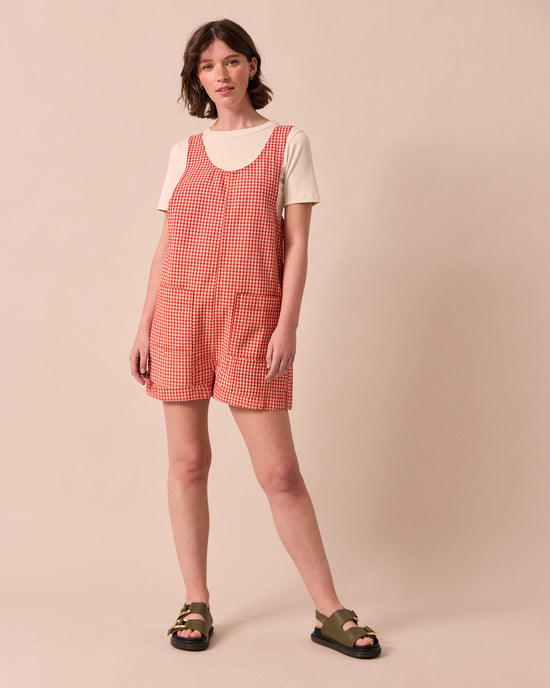 model wears anica poppy red gingham playsuit