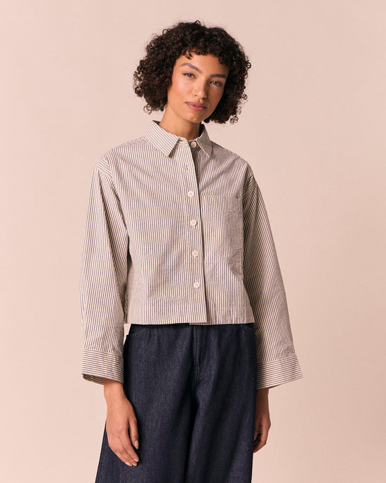 model wears anya blue and bone stripe seersucker shirt