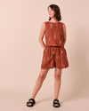 model wears arielle beachcomber print linen shorts. 