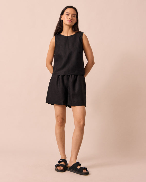 model wears arielle black linen shorts