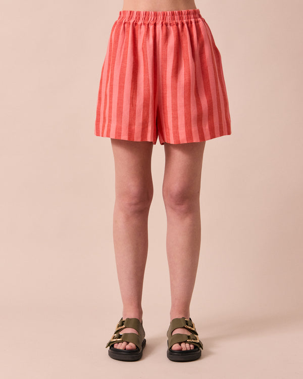 model wears arielle sorbet stripe linen shorts