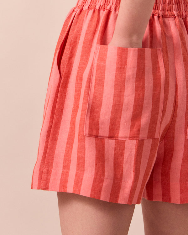 model wears arielle sorbet stripe linen shorts