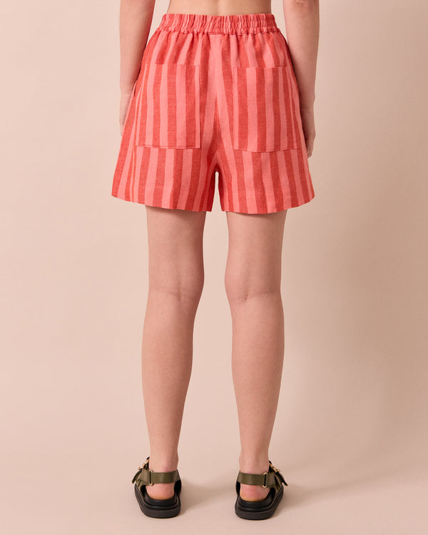 model wears arielle sorbet stripe linen shorts