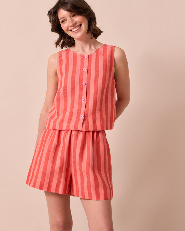 model wears arielle sorbet stripe linen shorts