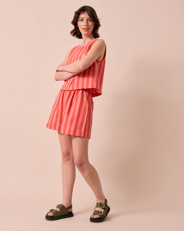 model wears arielle sorbet stripe linen shorts