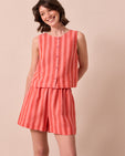 model wears arielle sorbet stripe linen shorts