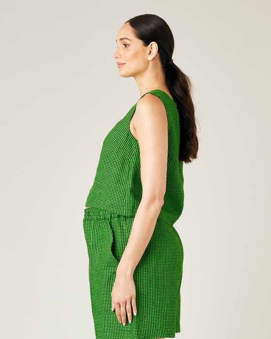 pregnant model wears green and black micro check esme top