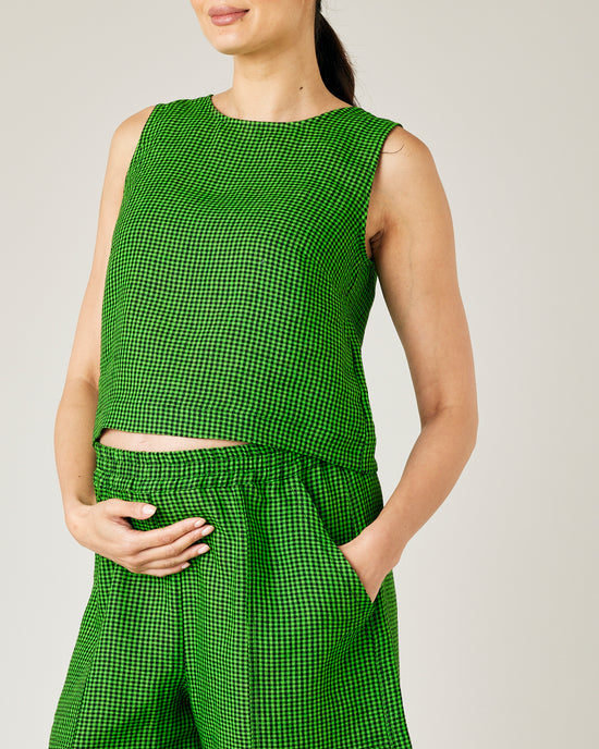 pregnant model wears green and black micro check esme top