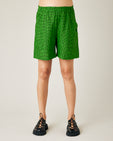 pregnant model wear green and black micro check ari shorts