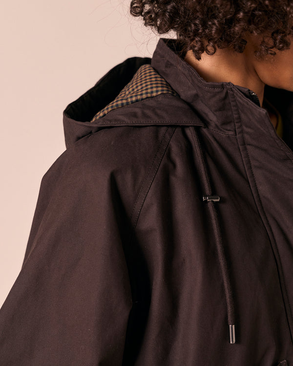 model wears averie ganache coated cotton jacket