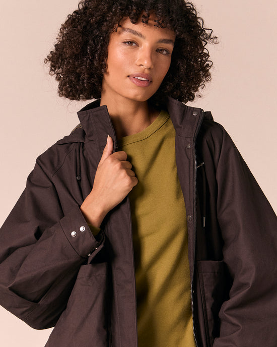 model wears averie ganache coated cotton jacket