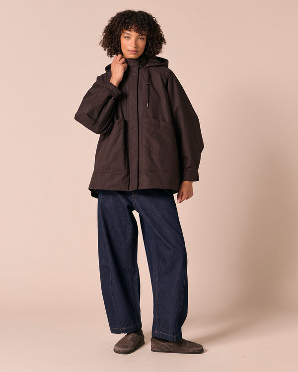 model wears averie ganache coated cotton jacket