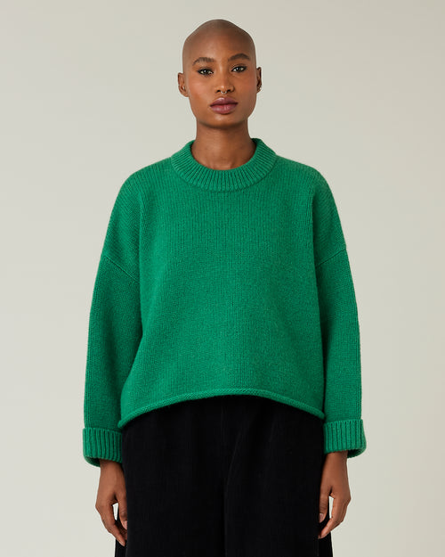 model wears green coco knitted jumper