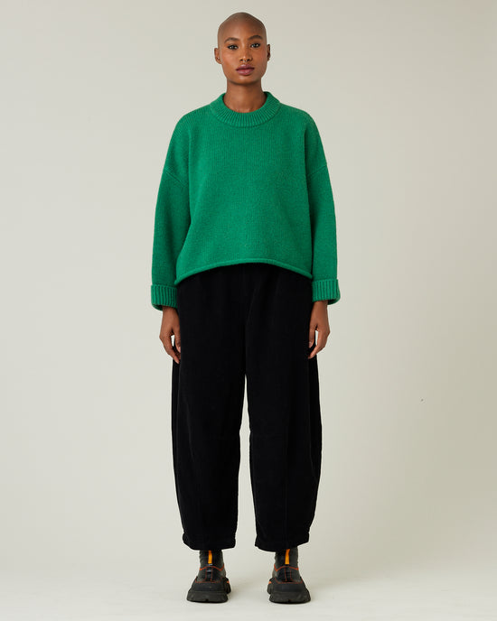 model wears daisy black cord trousers