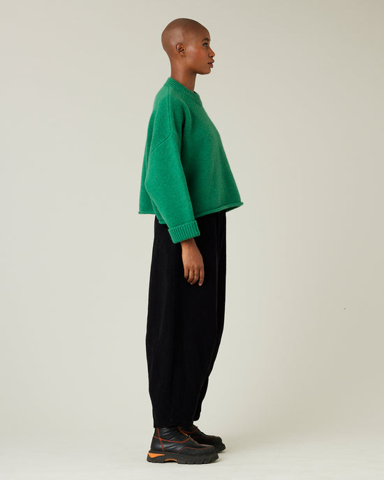 model wears daisy black cord trousers