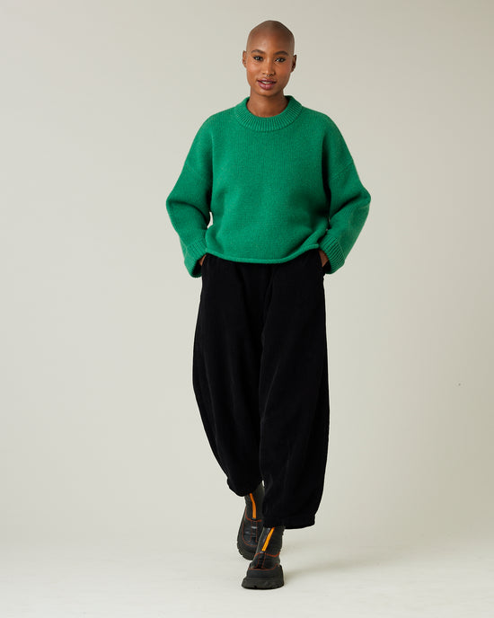 model wears daisy black cord trousers