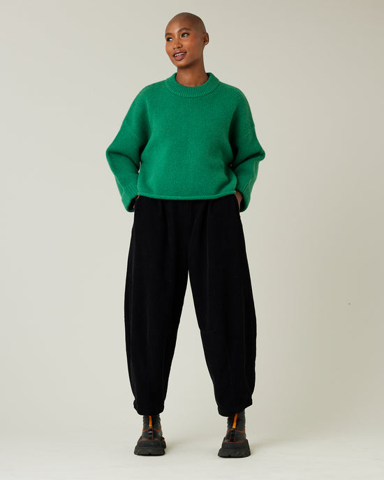 model wears daisy black cord trousers