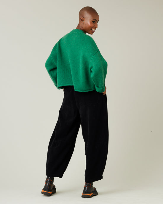 model wears daisy black cord trousers