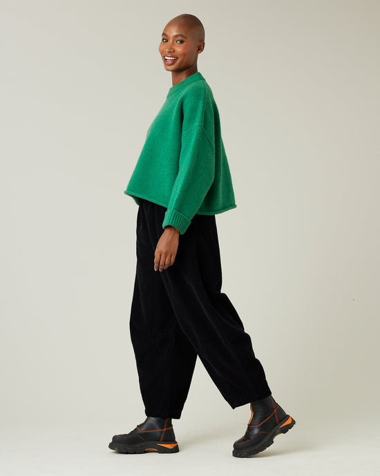 model wears daisy black cord trousers