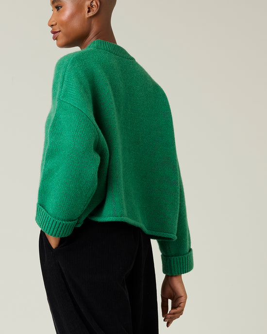 model wears green coco knitted jumper