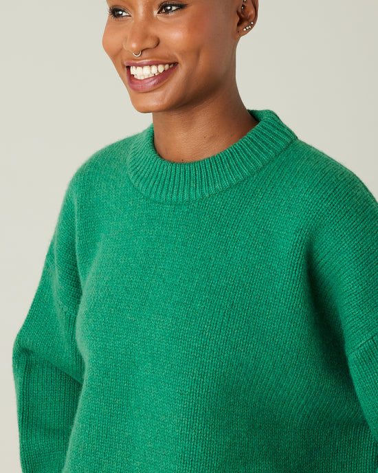 model wears green coco knitted jumper