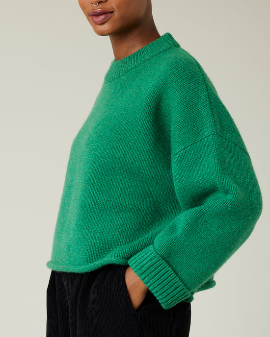 model wears green coco knitted jumper