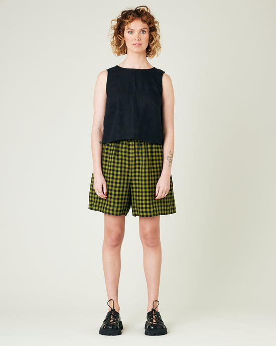 model wears green gingham ari shorts