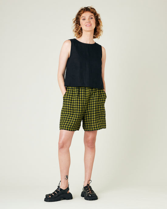 model wears green gingham ari shorts