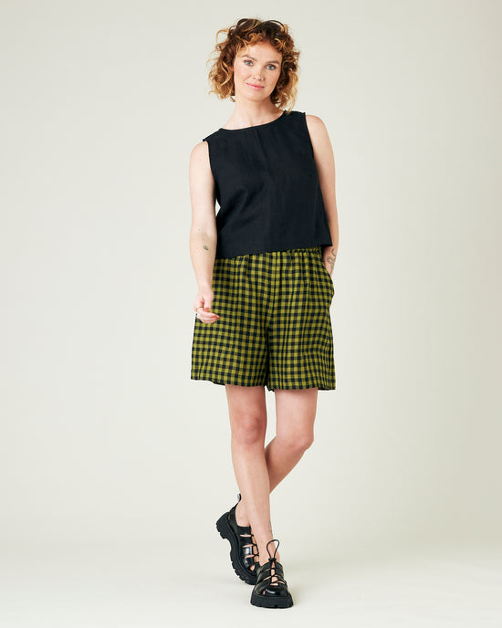 model wears green gingham ari shorts