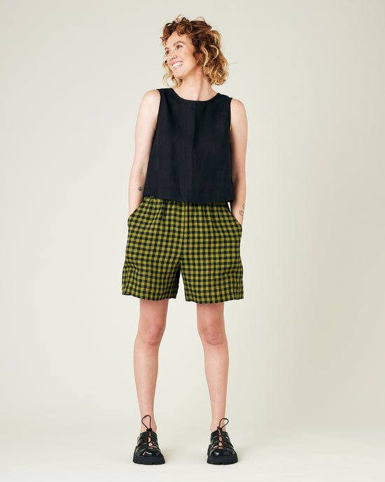 model wears green gingham ari shorts