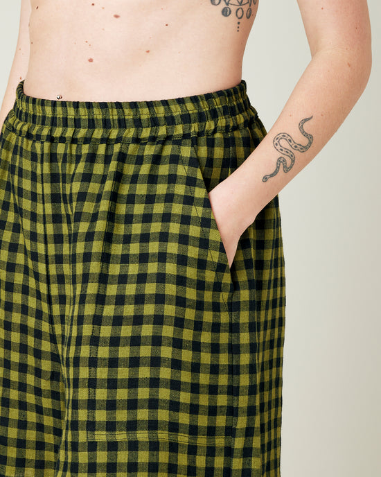 model wears green gingham ari shorts