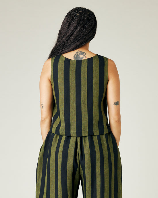 model wears olive and black stripe linen esme top