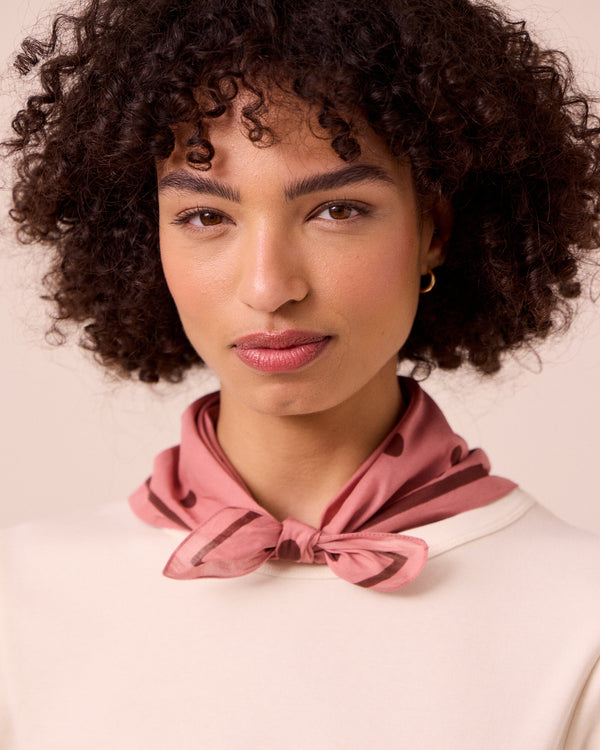 model wears clay pink spot cotton neckerchief