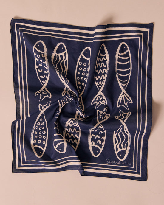 model wears fish print cotton bandana
