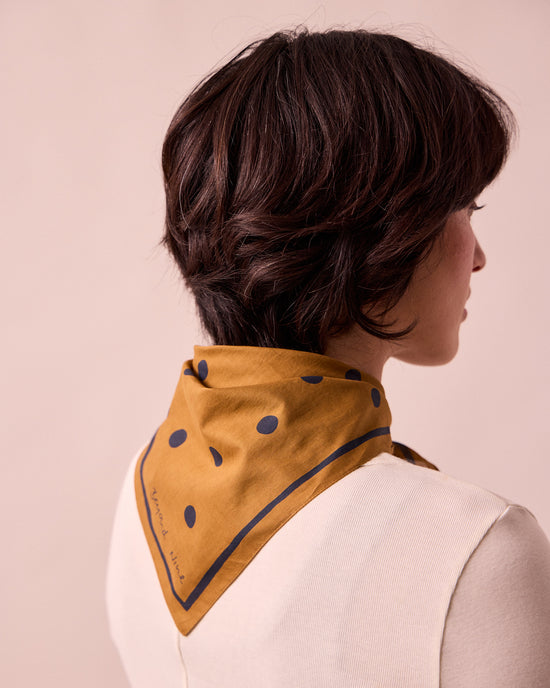 model wears toffee spotted neckerchief