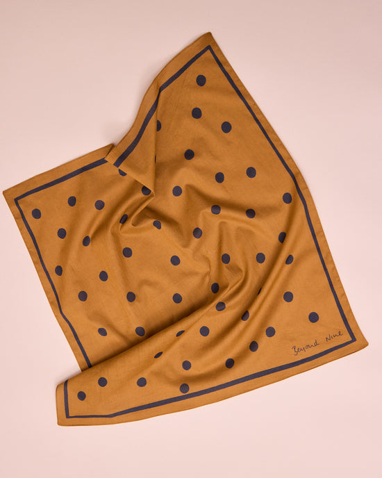 model wears toffee spotted neckerchief