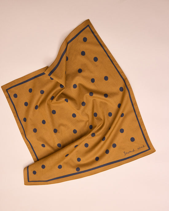 model wears toffee spotted neckerchief