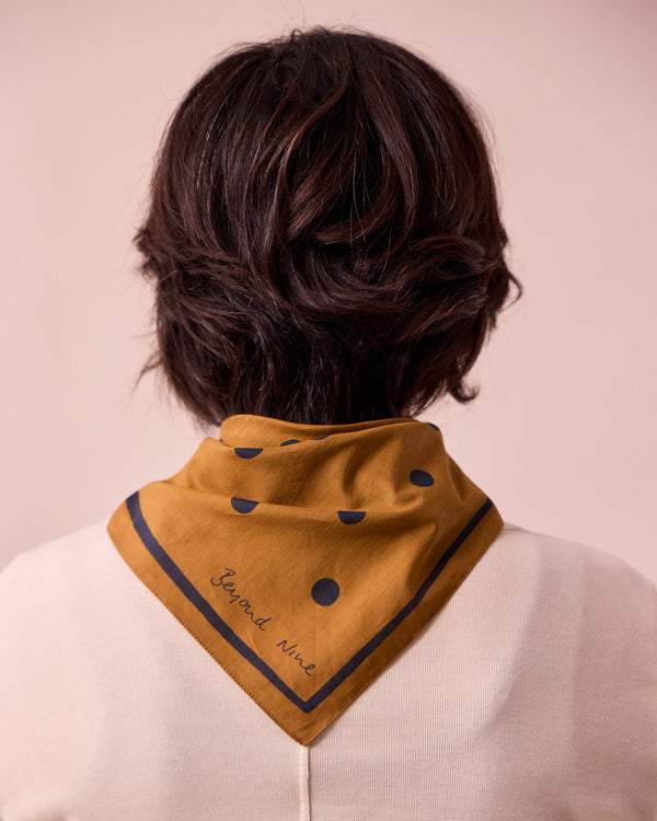 model wears toffee spotted neckerchief