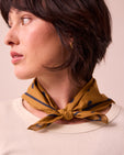 model wears toffee spotted neckerchief