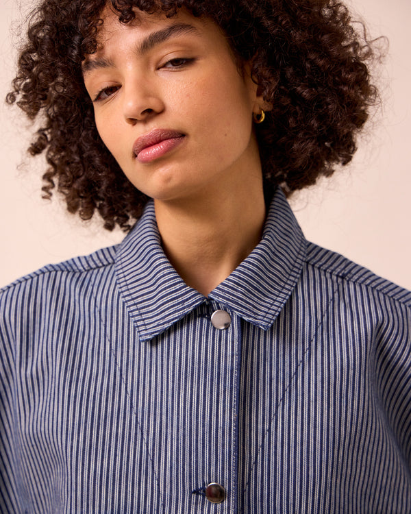 model wears bea navy hickory stripe denim jacket