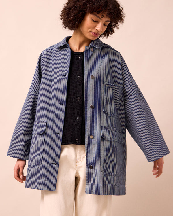 model wears bea navy hickory stripe denim jacket