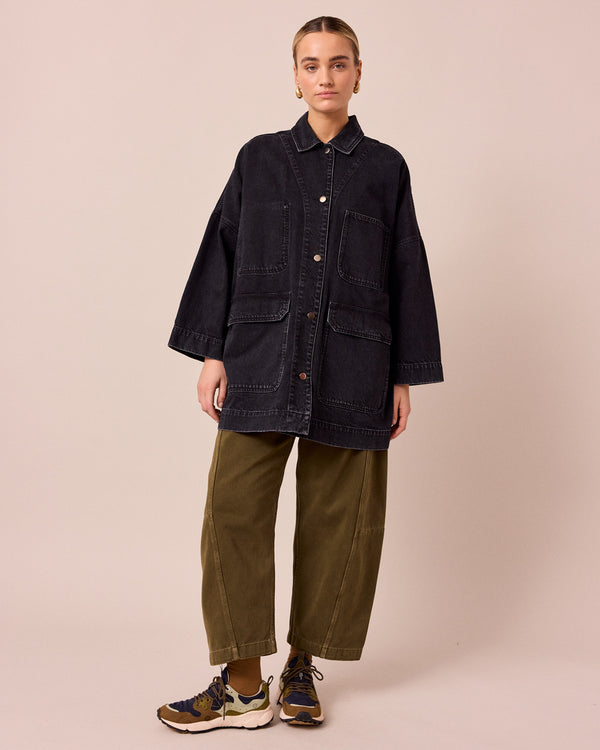 model wears bea washed black denim jacket