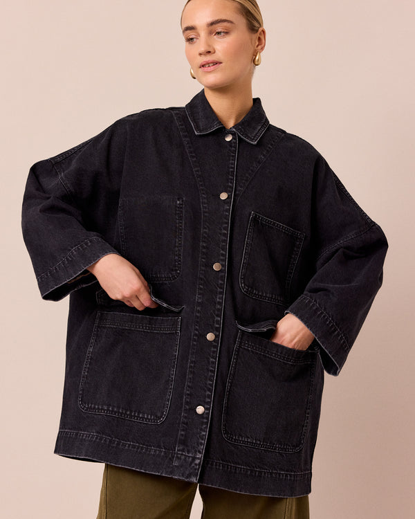 model wears bea washed black denim jacket